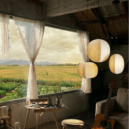 Artisan crafted paper globe pendant light in a minimalist Wabi-Sabi style