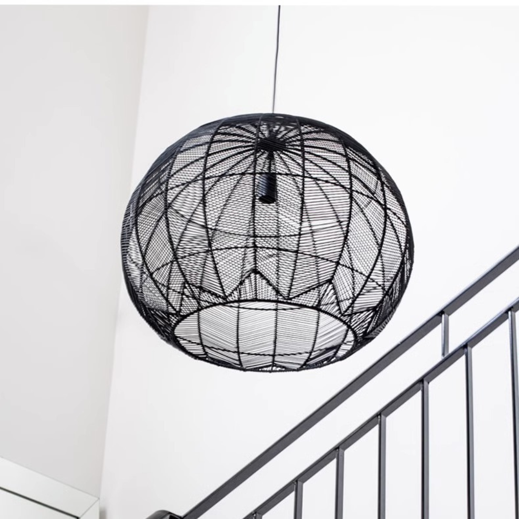 Contemporary black rattan woven pendant light in bright modern kitchen