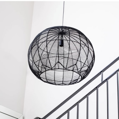 Contemporary black rattan woven pendant light in bright modern kitchen