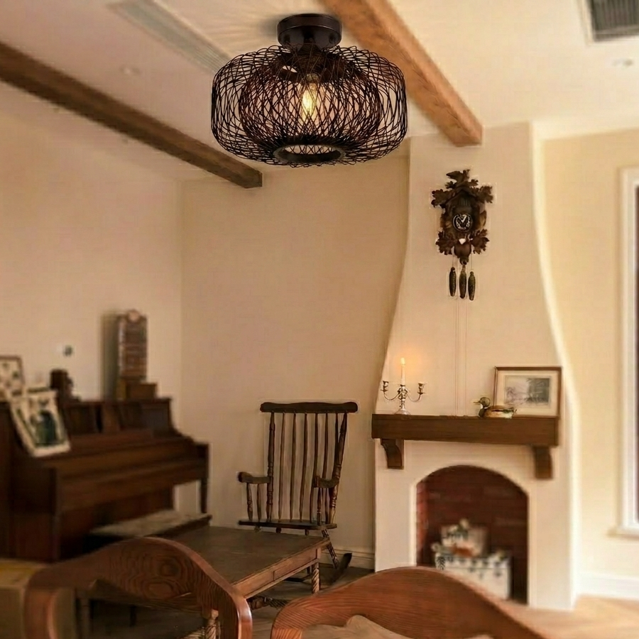 Elegant black wire mesh ceiling light enhancing the modern aesthetic of a living room.