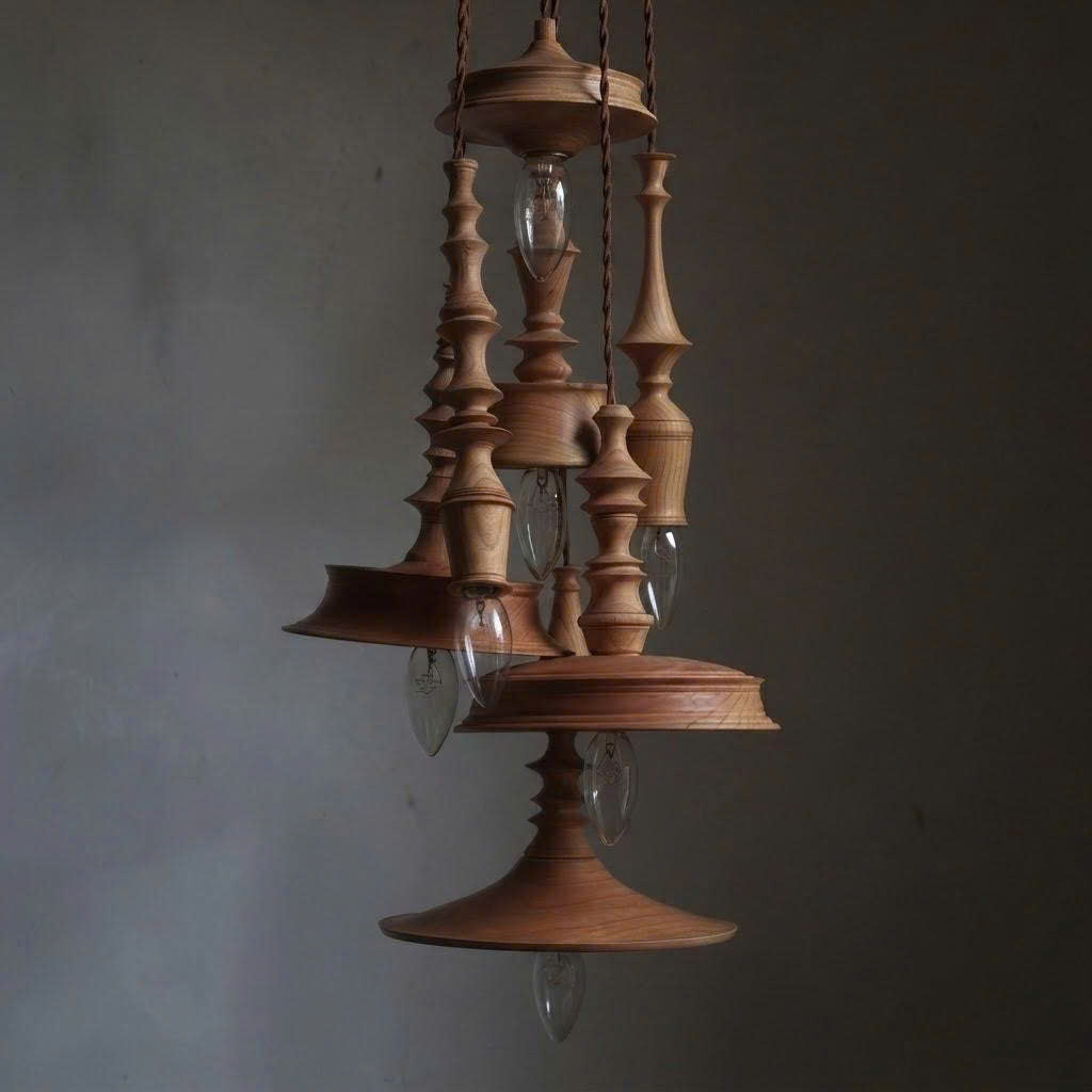 Ceiling pendant in modern turned wood style, perfect for wine cellar decor, creating a cozy and refined ambiance.
