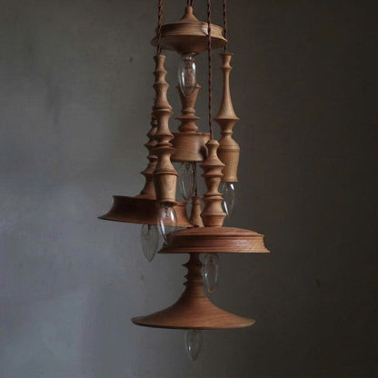 Ceiling pendant in modern turned wood style, perfect for wine cellar decor, creating a cozy and refined ambiance.