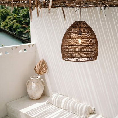 Coastal Mediterranean  inspired rattan hanging light capturing a serene, breezy beach-house atmosphere.