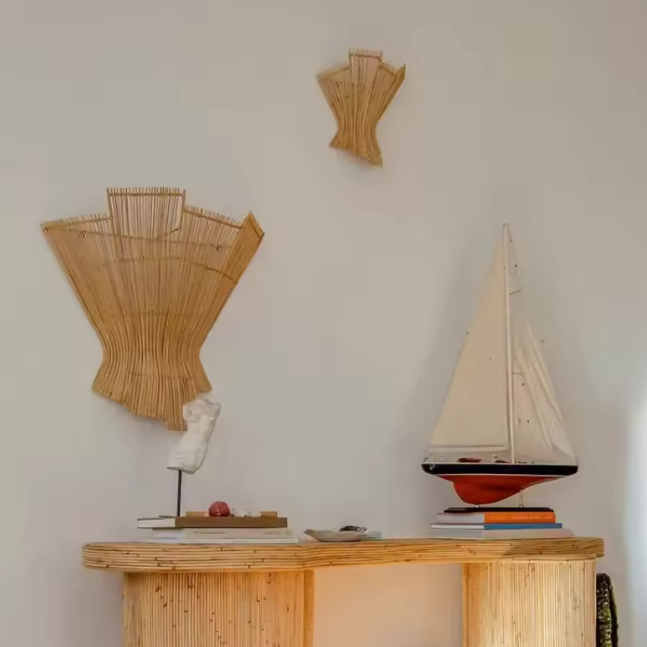 Organic rattan lamp for focused task lighting in a cozy reading corner.