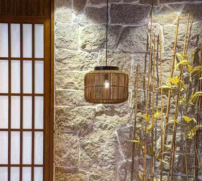 Cozy Zen living room chandelier cluster made of natural bamboo fibers hanging near a rustic wooden door.