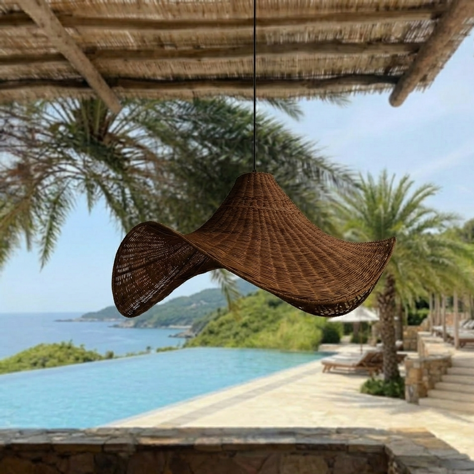 Handwoven natural rattan pendant light with a distinct sculptural wave design for organic home decor.