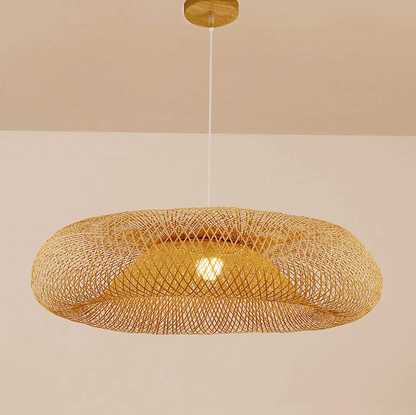 Round wicker ceiling fixture with an elegant dual-layer concentric mesh weave diffusing a warm amber glow.