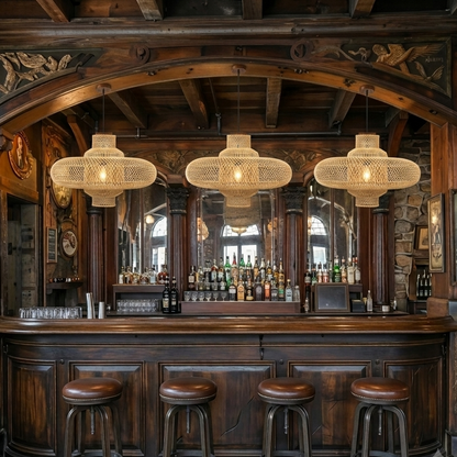 Mid-century organic drop light with a spindle top bamboo frame, styling a retro home bar.