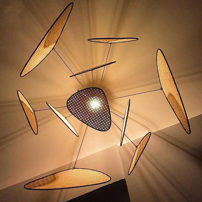 Grand rattan webbing chandelier with an organic multi-leaf design, perfect for high-ceiling living rooms.