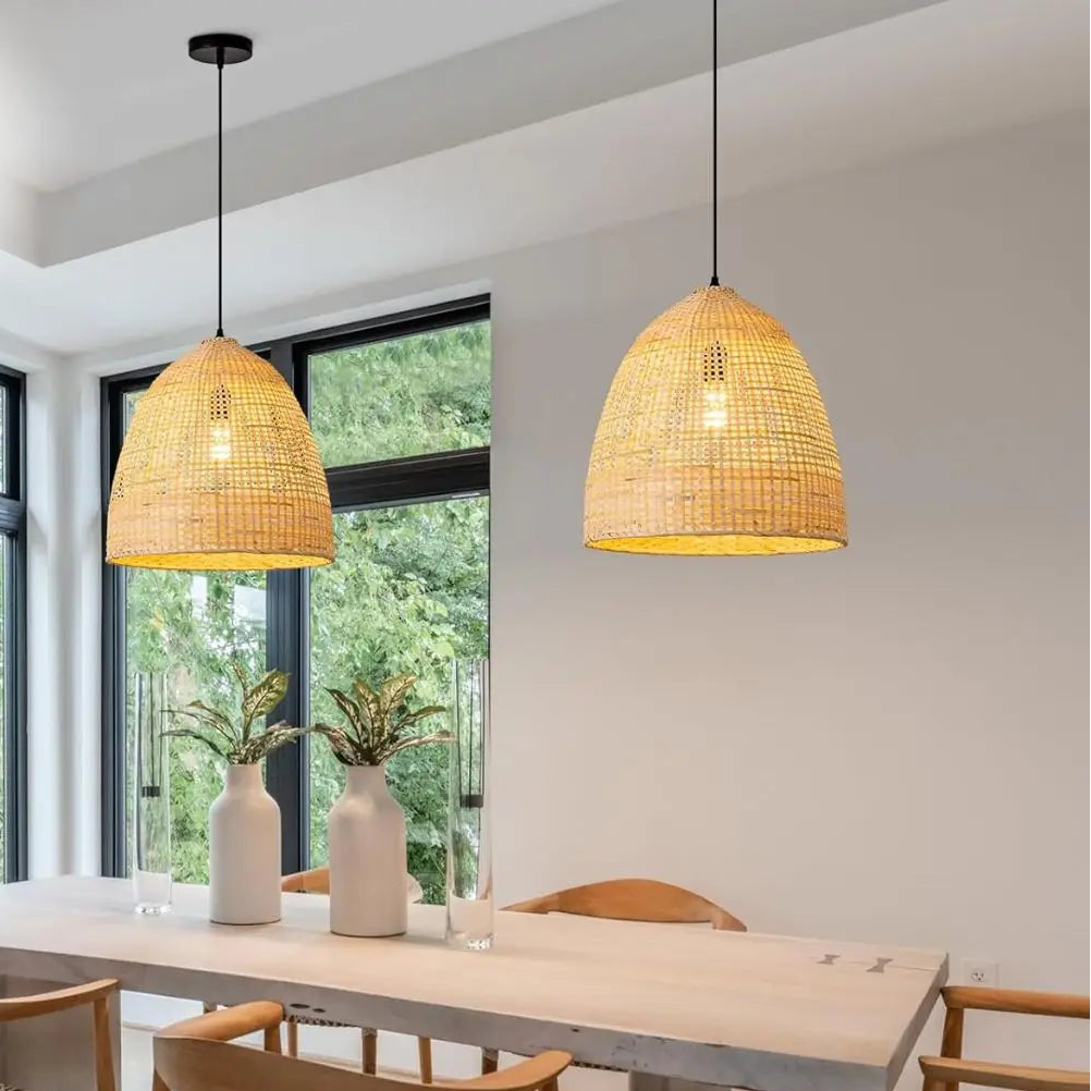 Hand-woven bamboo hanging light suspended over a dining table for an intimate, stylish kitchen dining setup.