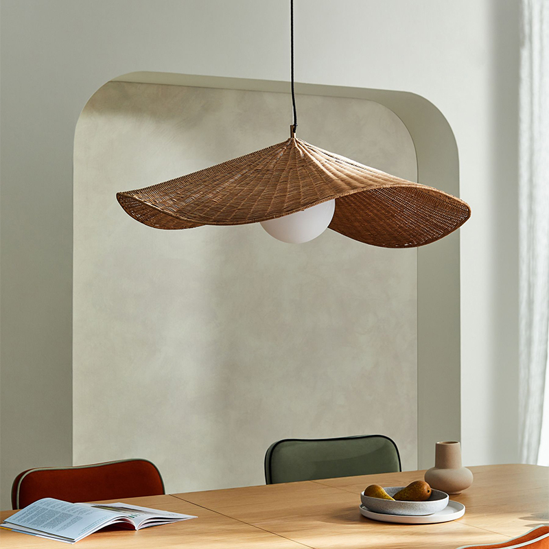 A view of the hand-woven wicker shade with a glass globe pendant
