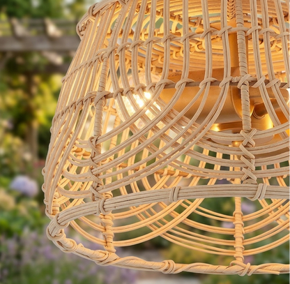 Handcrafted natural rattan flush mount ceiling light with intricate woven details and a brass base.