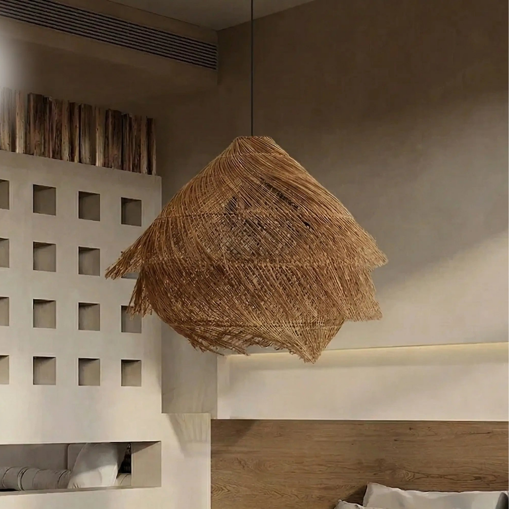 Artisan woven grass chandelier showing meticulous organic craftsmanship and detailed layered construction.