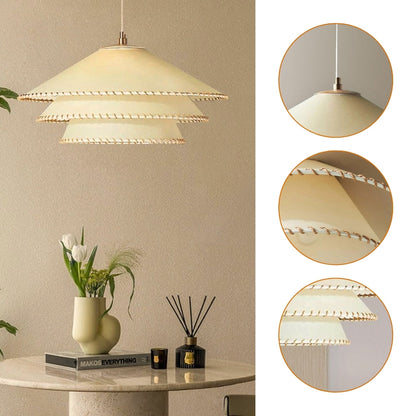 Handcrafted tiered fabric pendant light featuring beautiful decorative edge trim