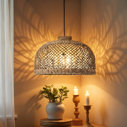 A close-up of a handwoven natural jute fiber pendant lamp