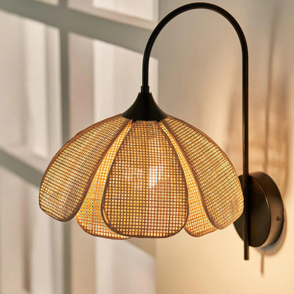 Sustainable handwoven rattan wall sconce for eco-friendly modern living room decor