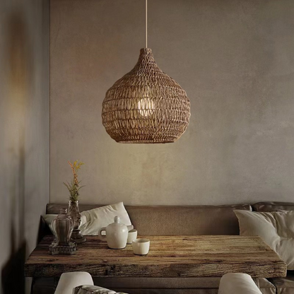 Handwoven seagrass bell pendant light with rich rope texture for natural home decor
