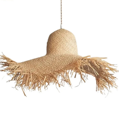 Handwoven seagrass fringed pendant lamp featuring detailed artisan fiber craftsmanship and natural texture.