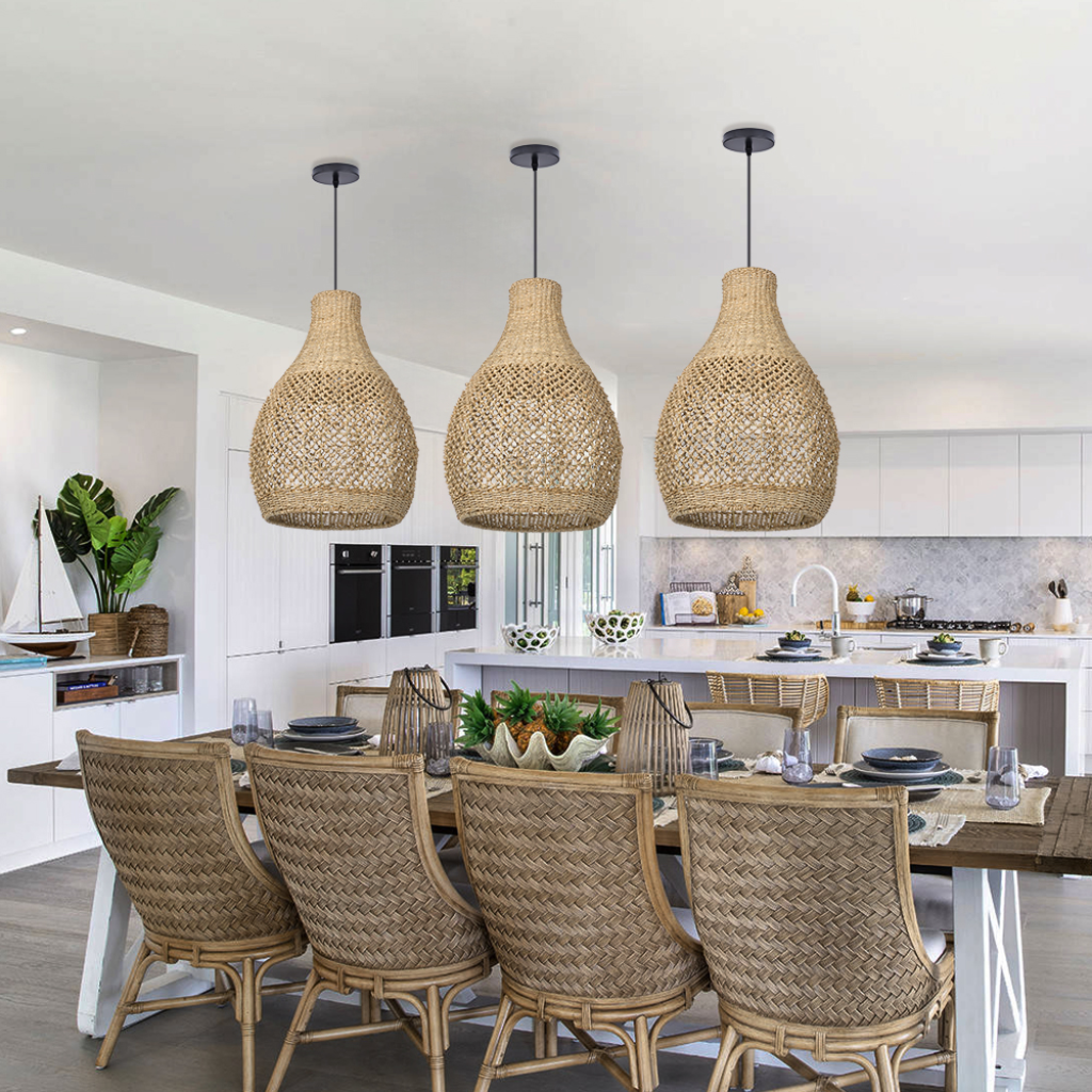 Elegant handwoven seagrass teardrop pendant light illuminating a modern kitchen island