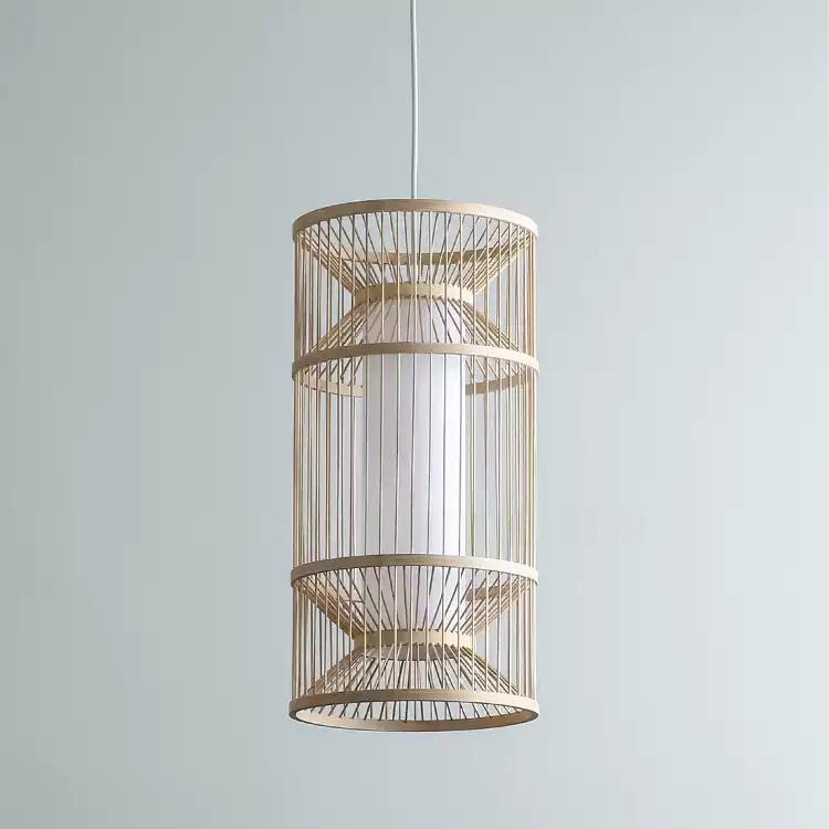 apandi style hanging lamp with sculptural bamboo slat, hanging beautifully over a dining table.