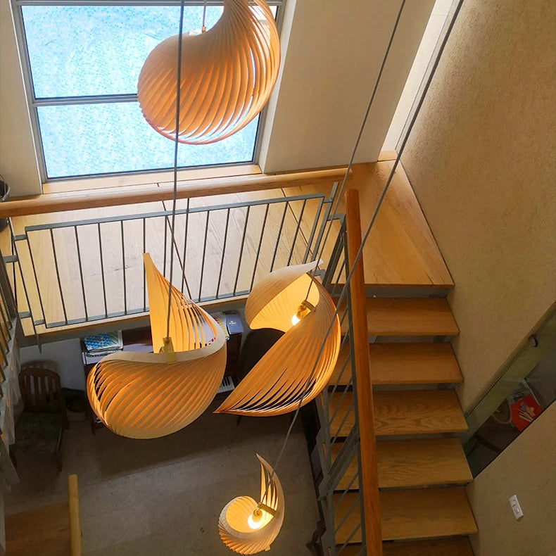Hanging lamp in Modernism style, featuring wood material, creating a minimalist, textured look for interior decor.