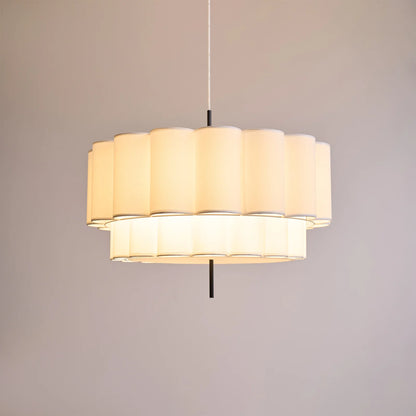 Hanging lamp with natural fabric texture, perfect for art rooms, providing gentle mood lighting for creative spaces.