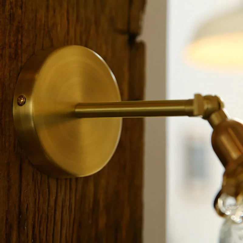 Close-up of a gold door handle on a wooden door