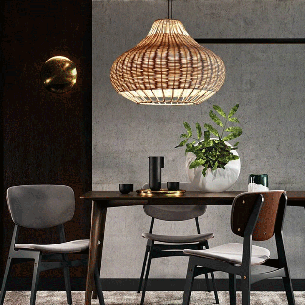 Wabi-sabi style bamboo pendant lamp illuminating a minimalist kitchen table with neutral tones.