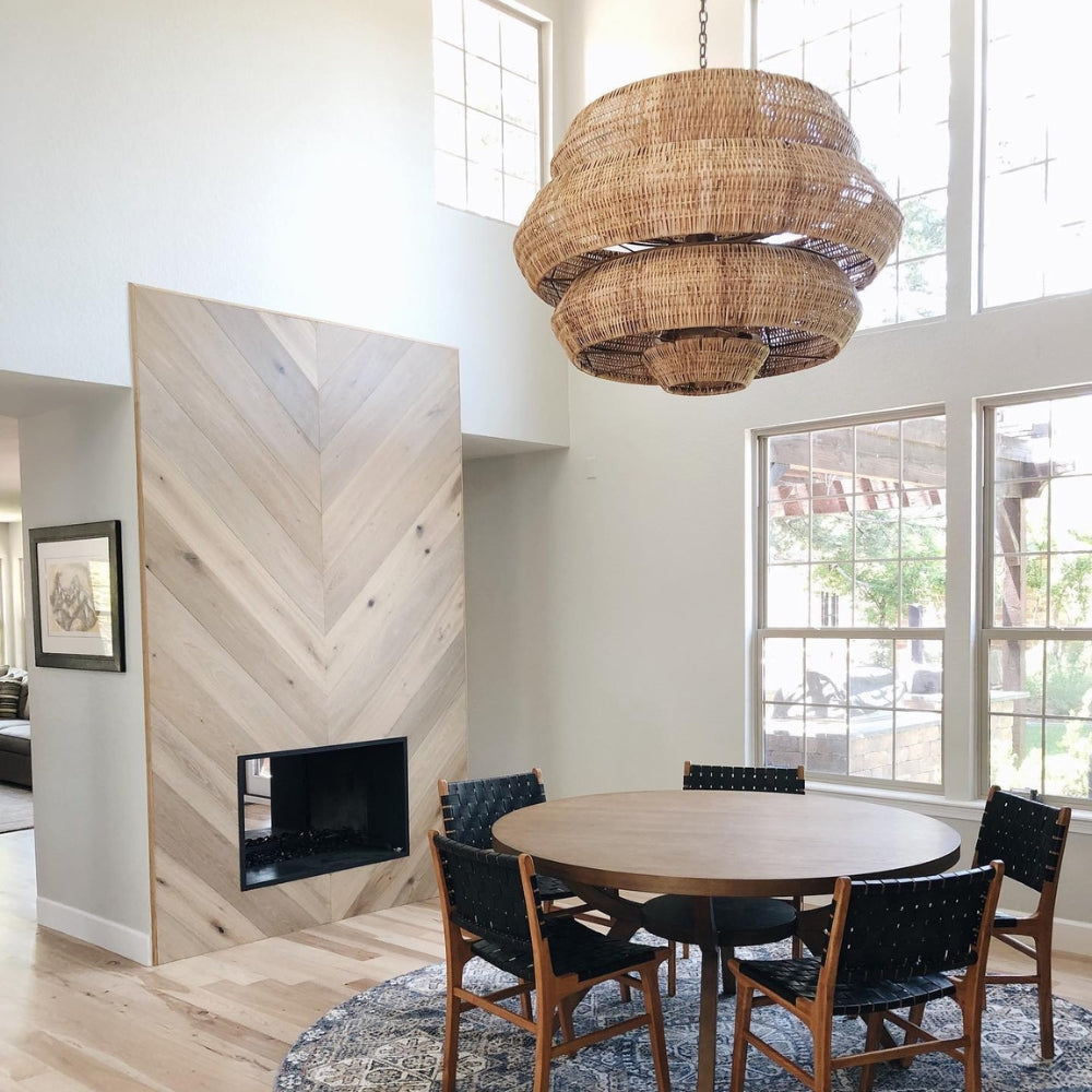 Japandi living room rattan pendant light creating a warm amber glow, ideal for adding rich textural contrast to neutral home decor.