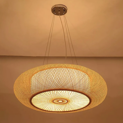  Large Japandi rattan saucer pendant light with an intricate criss-cross weave pattern throwing a warm radial glow 