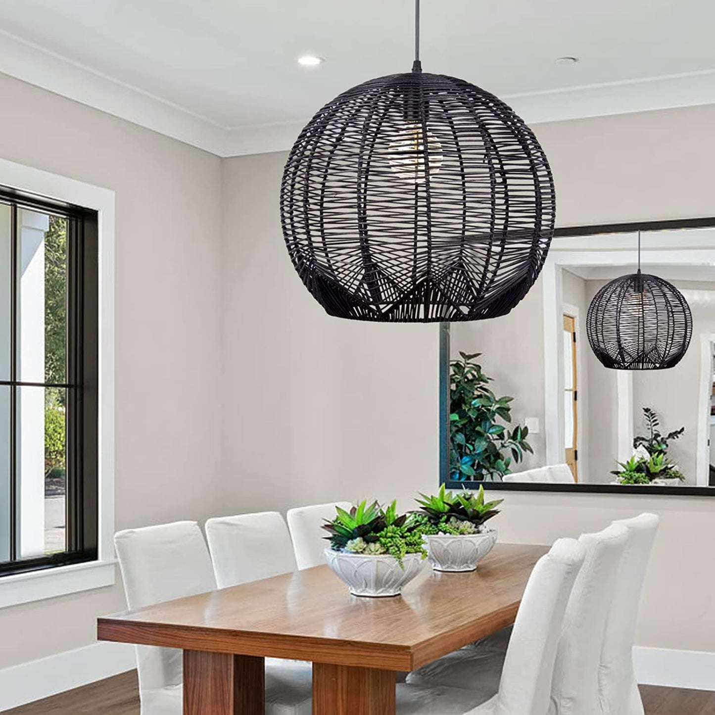 Modern black woven rattan basket pendant lamp over dining table