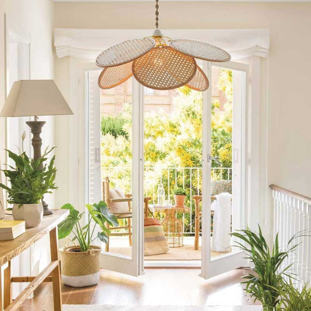 Minimalist cane petal hanging lamp showcasing intricate woven rattan patterns in a soft, natural wood finish.