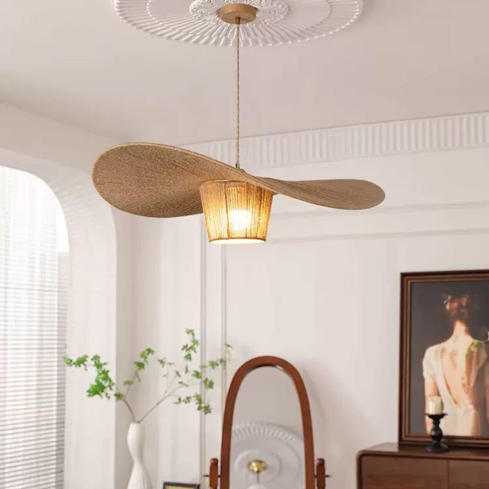 Minimalist natural fiber pendant light with a rustic hat-style silhouette