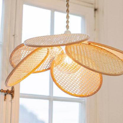 Modern Japandi rattan bloom pendant featuring a unique flower-shaped design with round cane mesh panels.