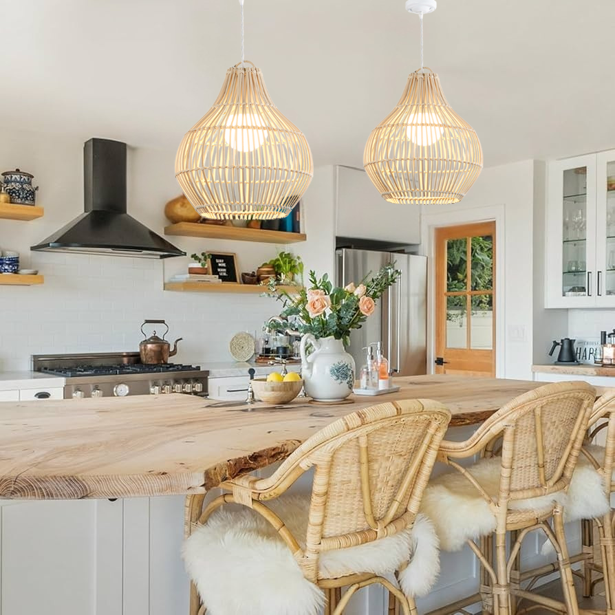 Handwoven rattan teardrop pendant light hanging over a white kitchen island