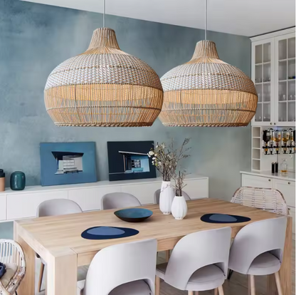 Elegant wide dome kitchen light styled as a linear pair setup over a contemporary kitchen workspace with white cabinets and a steel fridge.