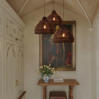 Inviting natural rattan pendant ceiling light installed in a stylish, modern home entryway.