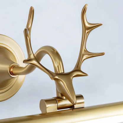 Sculptural organic modern brass antler sconce for a living room art centerpiece