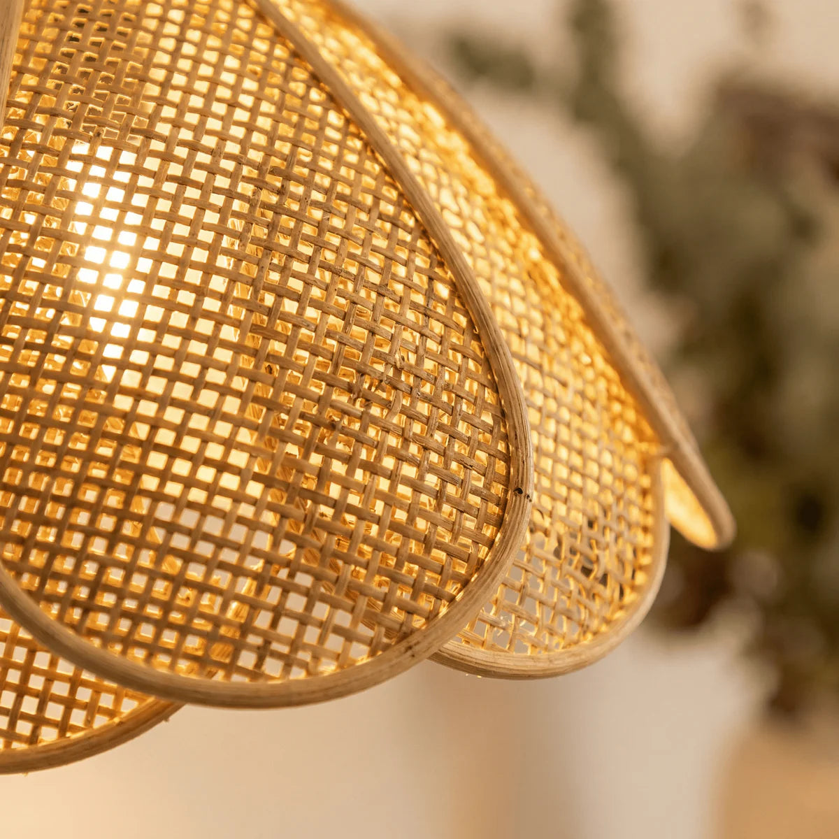 Organic hand-made rattan wall sconce for a serene eco-friendly lounge area