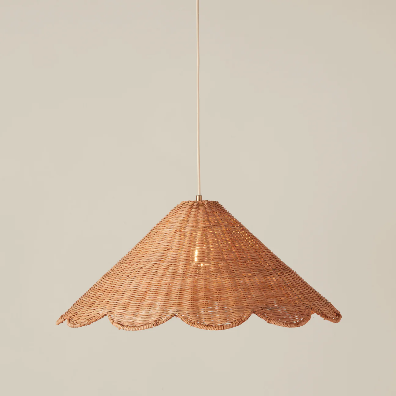 Hand-assembled pure rattan weave cone pendant, an example of zero-waste and sustainable home decor.