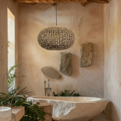 Soft glowing jute pendant light creating a spa-like atmosphere over a freestanding bathtub