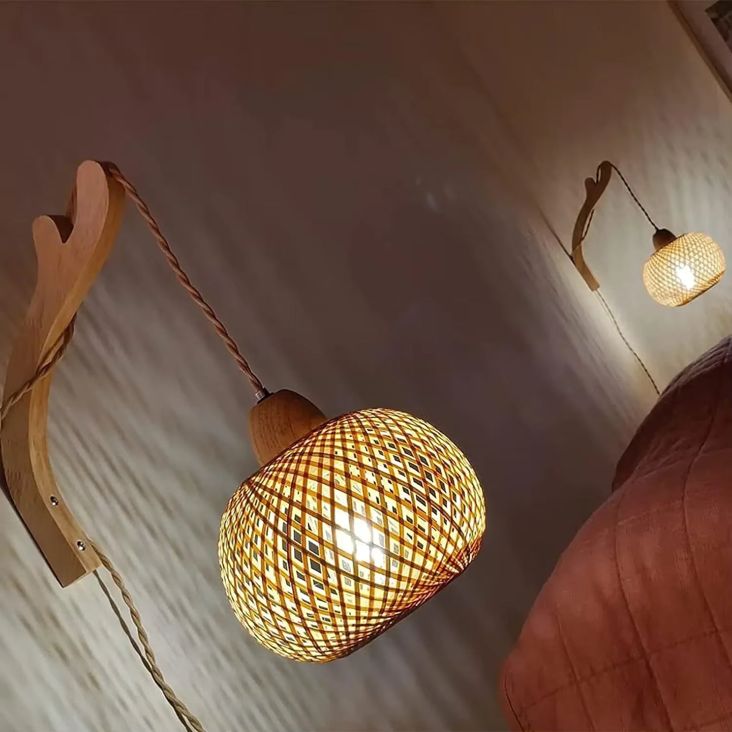 Woven pendant light fixture with wooden accents on a neutral wall.