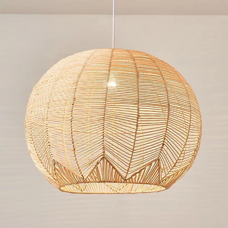 Coastal interior design featuring a large woven rattan dome chandelier