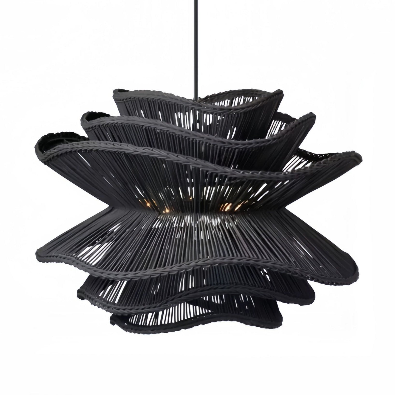 Rustic yet elegant wavy rattan hanging lantern fixture from the Made Goods Alondra lighting collection.