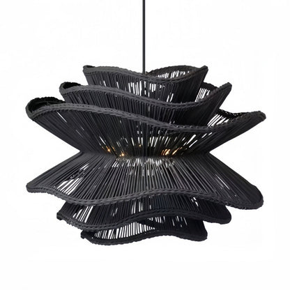 Rustic yet elegant wavy rattan hanging lantern fixture from the Made Goods Alondra lighting collection.