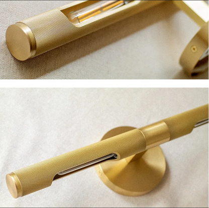 A close-up of a brass bathroom fixture, showing both a detailed view of the cylindrical handle with a textured grip and a view of the round mounting base on a light fabric background.