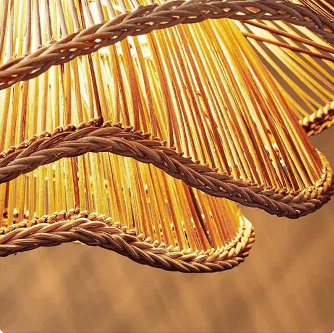 Scandianvian aesthetic woven rattan pendant fixture with multi-layered light filtering shades.