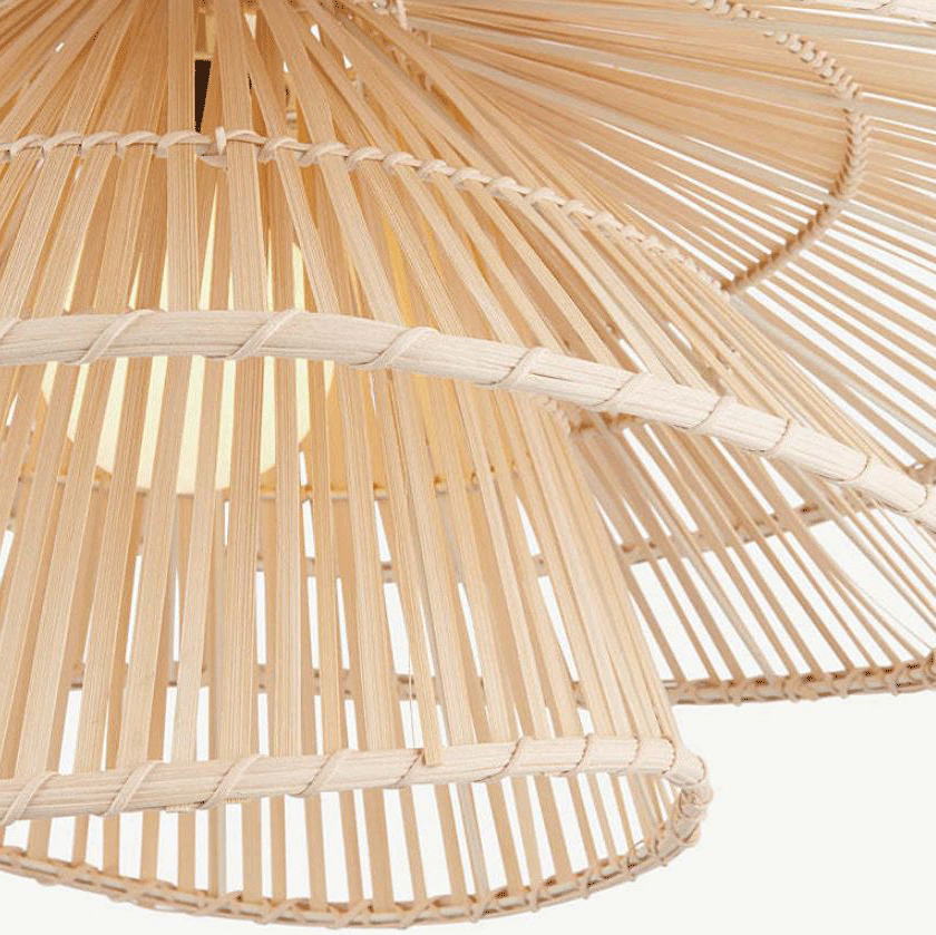 Sculptural bamboo pendant lamp with double-layer flared tiers glowing elegantly in a modern home