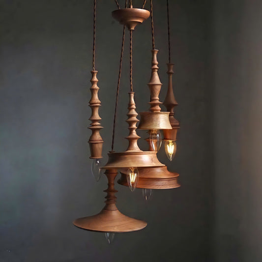 Sculptural lighting in quiet luxury style, crafted from premium turned wood, ideal for a cozy home, offering refined mood lighting.