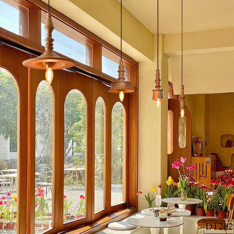 Sculptural lighting in Scandinavian style, turned wood material, perfect for elegant and natural resort lighting.